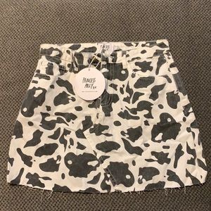 Cow print jean mini skirt.